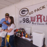 Todd and Katie announcing the 50/50 raffle winner!