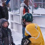 This little boy was telling NMU hockey player #3 all about this plans to be on the team one day.