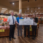 Super One Foods Marquette Store Manager Mike Levine, Todd Noordyk, Township Manager Randy Girard and Township Supervisor Lyn Durant.